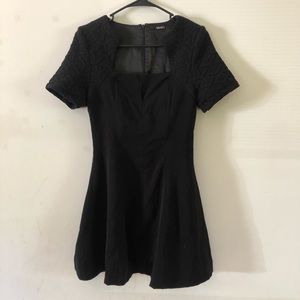Lulu’s black quilted jagged neckline skater dress